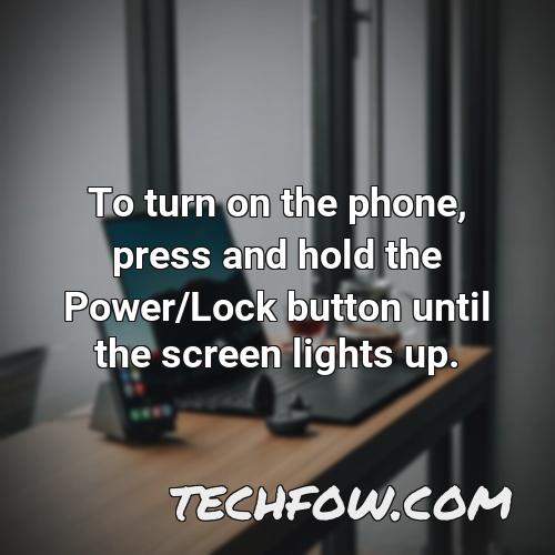 to turn on the phone press and hold the power lock button until the screen lights up