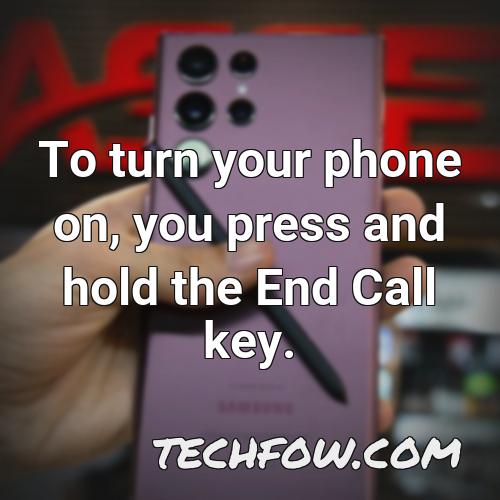 to turn your phone on you press and hold the end call key