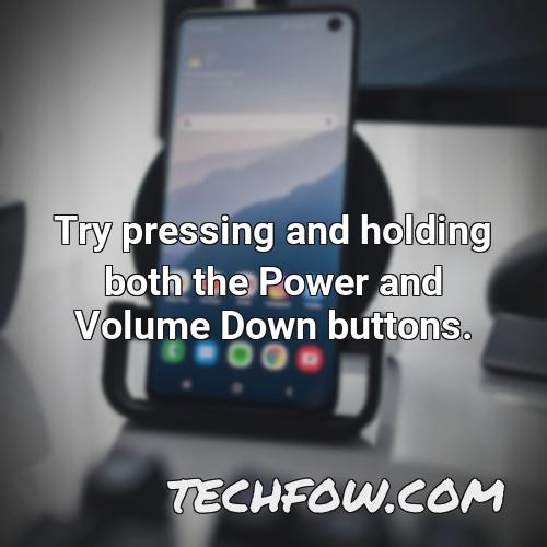 try pressing and holding both the power and volume down buttons