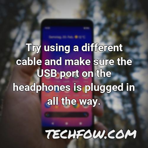 try using a different cable and make sure the usb port on the headphones is plugged in all the way