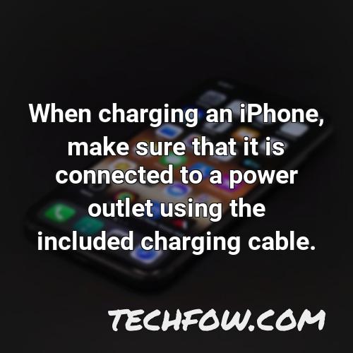 when charging an iphone make sure that it is connected to a power outlet using the included charging cable