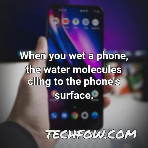 when you wet a phone the water molecules cling to the phone s surface