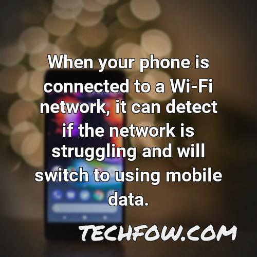 when your phone is connected to a wi fi network it can detect if the network is struggling and will switch to using mobile data