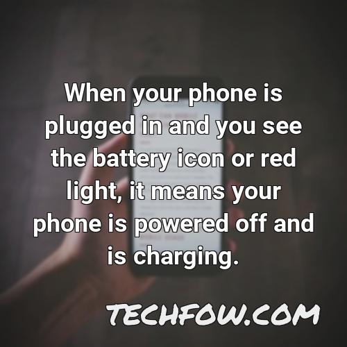 when your phone is plugged in and you see the battery icon or red light it means your phone is powered off and is charging