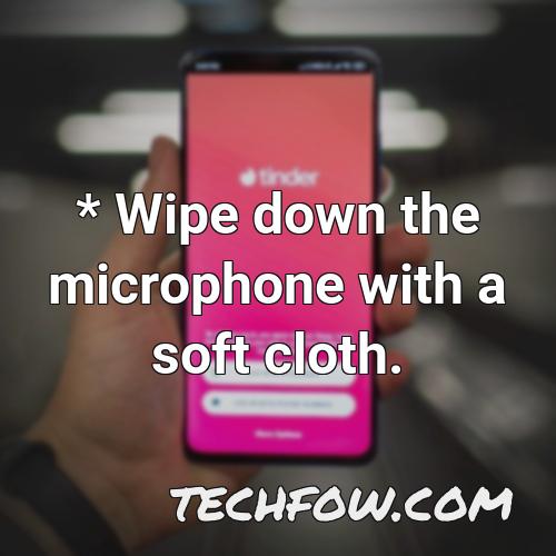 wipe down the microphone with a soft cloth
