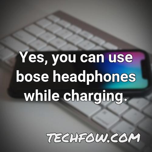 yes you can use bose headphones while charging