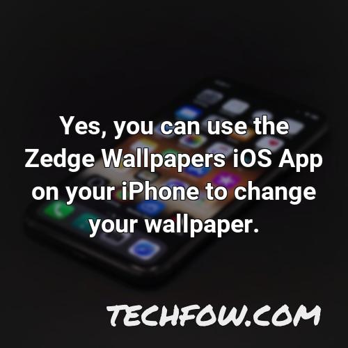 yes you can use the zedge wallpapers ios app on your iphone to change your wallpaper