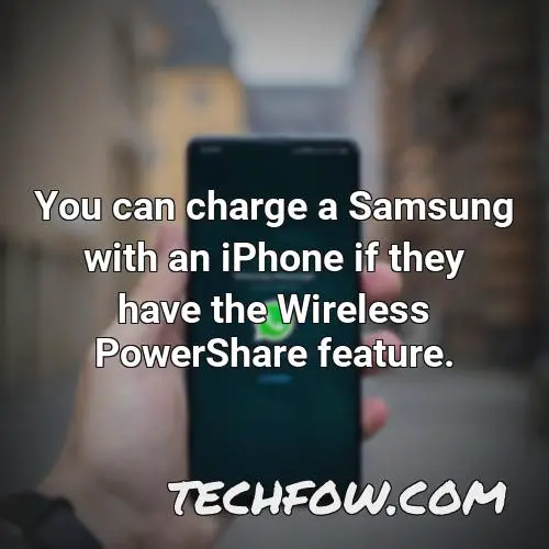you can charge a samsung with an iphone if they have the wireless powershare feature