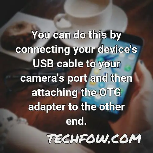 you can do this by connecting your device s usb cable to your camera s port and then attaching the otg adapter to the other end