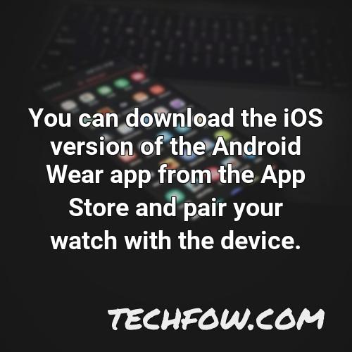 you can download the ios version of the android wear app from the app store and pair your watch with the device