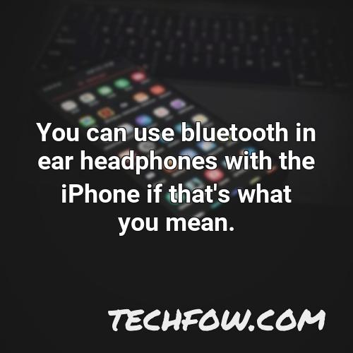 you can use bluetooth in ear headphones with the iphone if that s what you mean