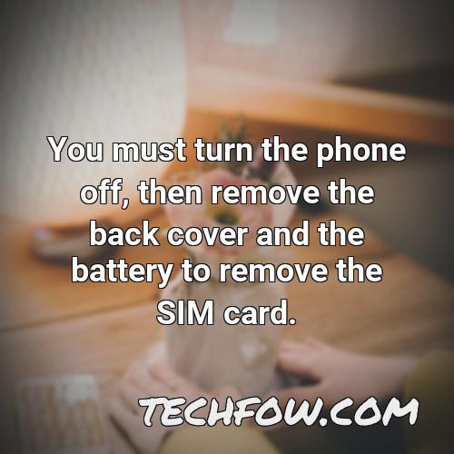 you must turn the phone off then remove the back cover and the battery to remove the sim card