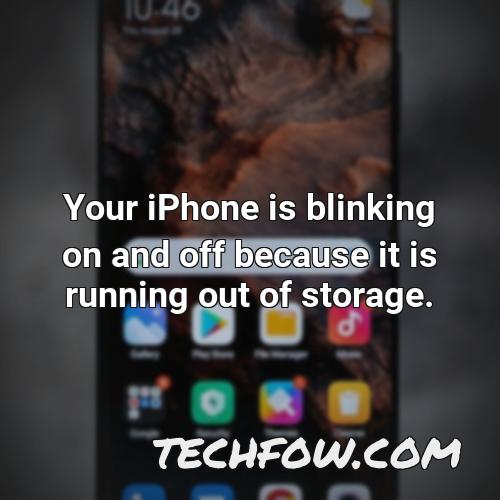 your iphone is blinking on and off because it is running out of storage