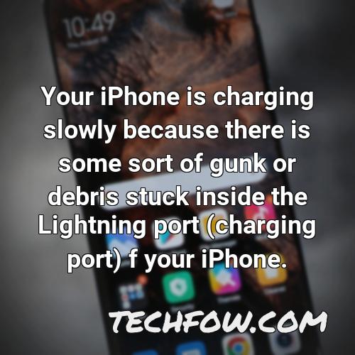 your iphone is charging slowly because there is some sort of gunk or debris stuck inside the lightning port charging port f your iphone 2