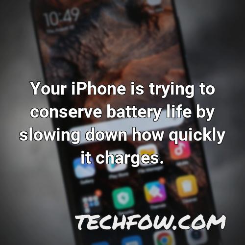 your iphone is trying to conserve battery life by slowing down how quickly it charges