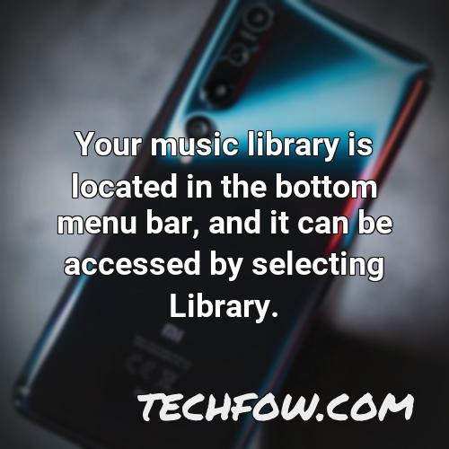 your music library is located in the bottom menu bar and it can be accessed by selecting library