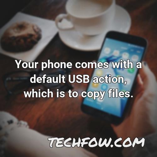 your phone comes with a default usb action which is to copy files