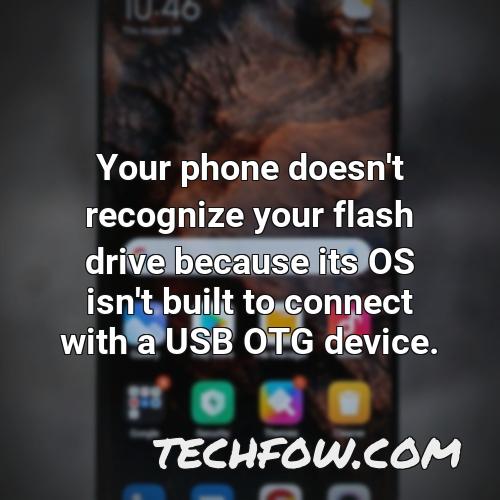 your phone doesn t recognize your flash drive because its os isn t built to connect with a usb otg device