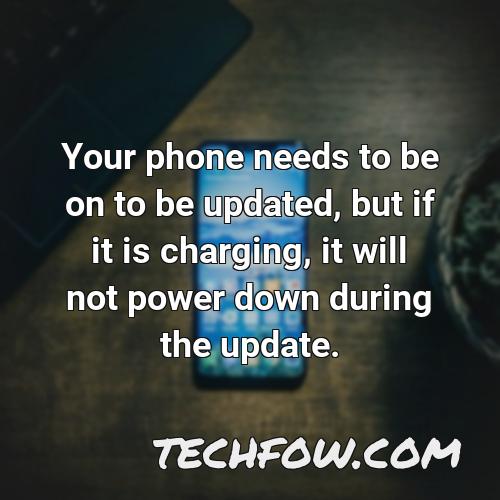 your phone needs to be on to be updated but if it is charging it will not power down during the update