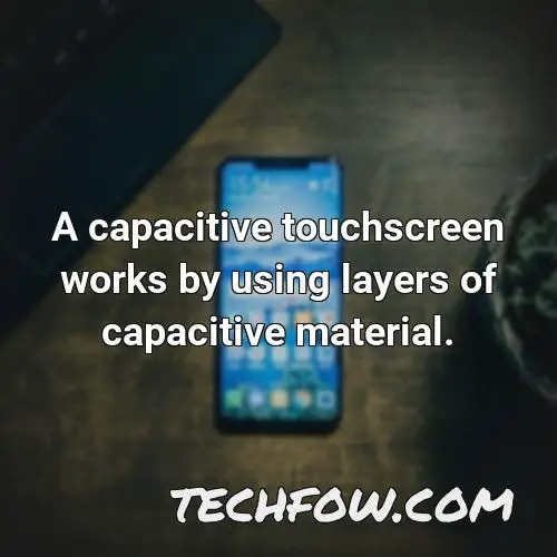 a capacitive touchscreen works by using layers of capacitive material