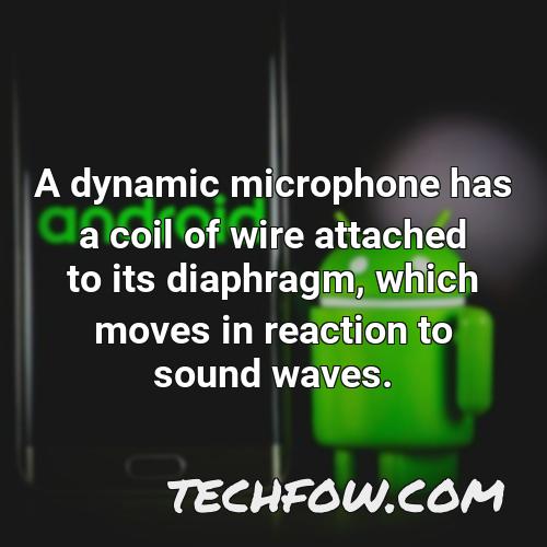 a dynamic microphone has a coil of wire attached to its diaphragm which moves in reaction to sound waves