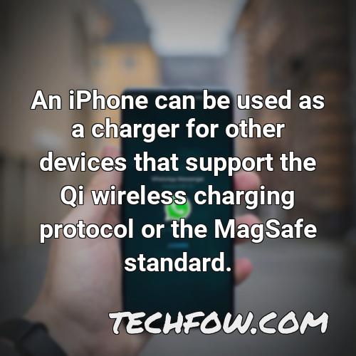 an iphone can be used as a charger for other devices that support the qi wireless charging protocol or the magsafe standard