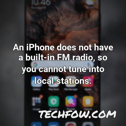 an iphone does not have a built in fm radio so you cannot tune into local stations