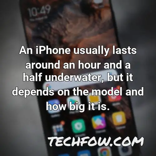 an iphone usually lasts around an hour and a half underwater but it depends on the model and how big it is