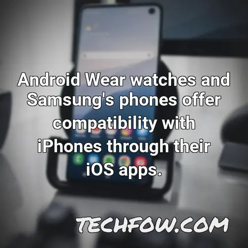 android wear watches and samsung s phones offer compatibility with iphones through their ios apps