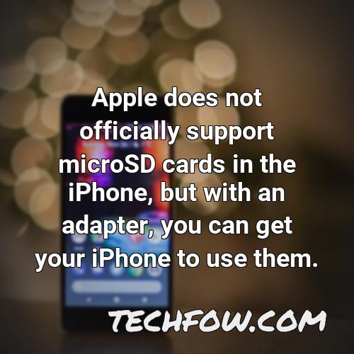 apple does not officially support microsd cards in the iphone but with an adapter you can get your iphone to use them