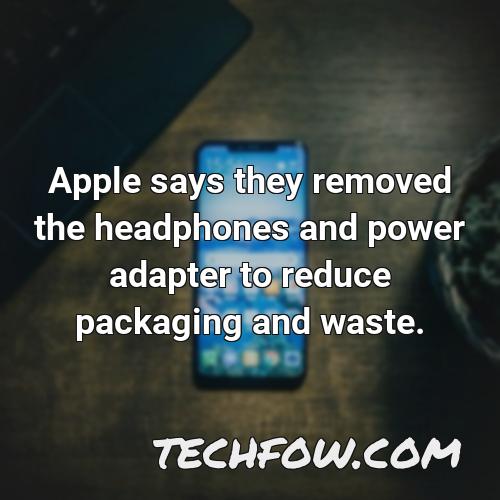 apple says they removed the headphones and power adapter to reduce packaging and waste
