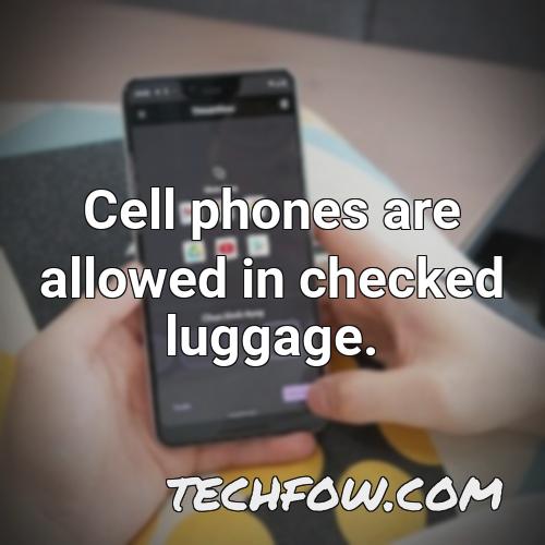 cell phones are allowed in checked luggage