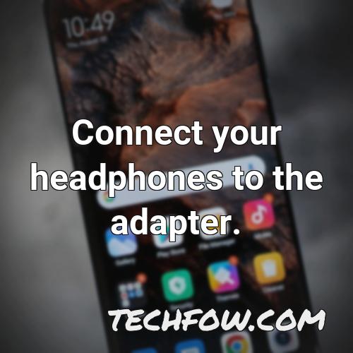 connect your headphones to the adapter 2