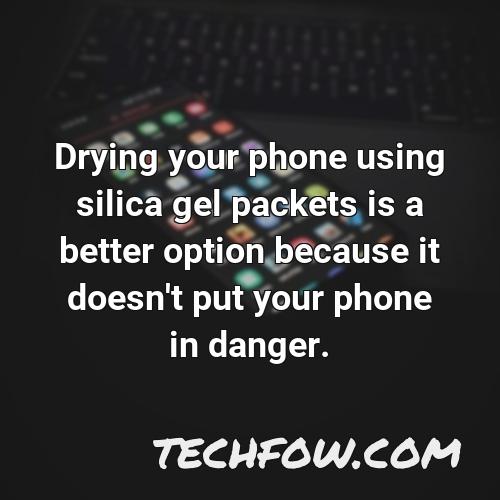 drying your phone using silica gel packets is a better option because it doesn t put your phone in danger