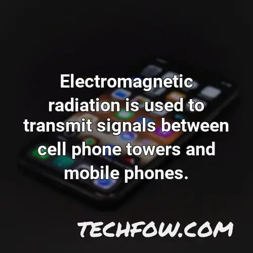 electromagnetic radiation is used to transmit signals between cell phone towers and mobile phones