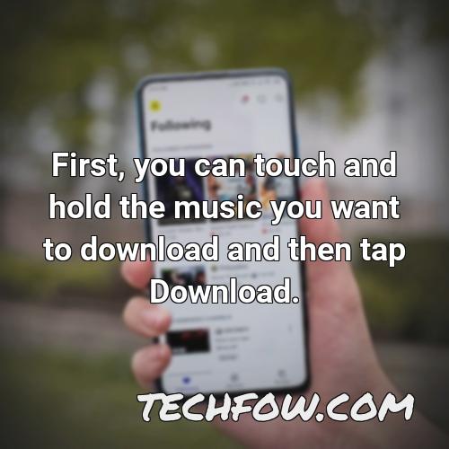 first you can touch and hold the music you want to download and then tap download