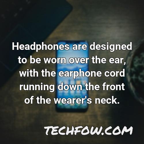 headphones are designed to be worn over the ear with the earphone cord running down the front of the wearer s neck