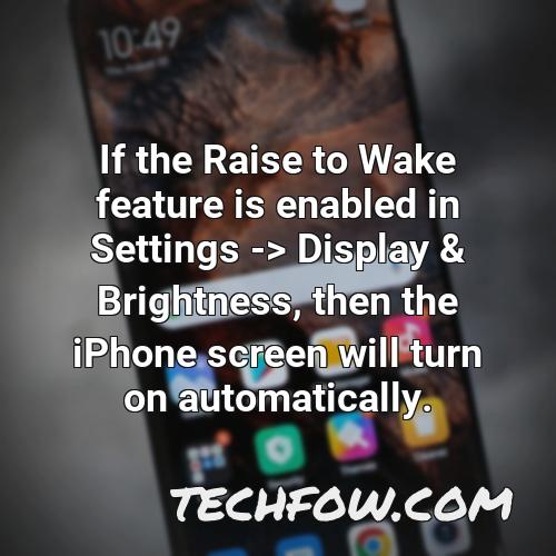 if the raise to wake feature is enabled in settings display brightness then the iphone screen will turn on automatically