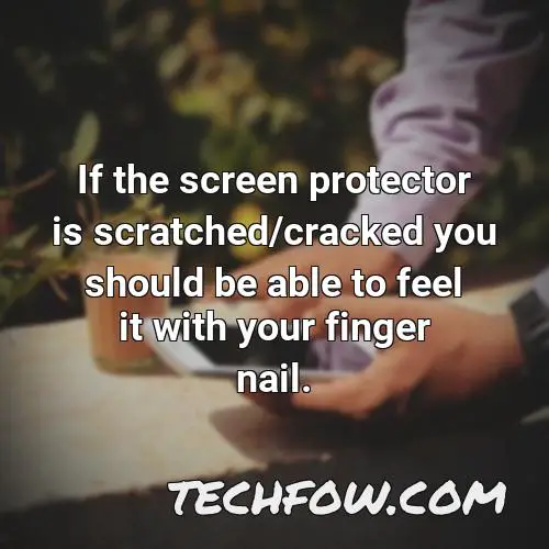 if the screen protector is scratched cracked you should be able to feel it with your finger nail