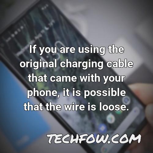 if you are using the original charging cable that came with your phone it is possible that the wire is loose