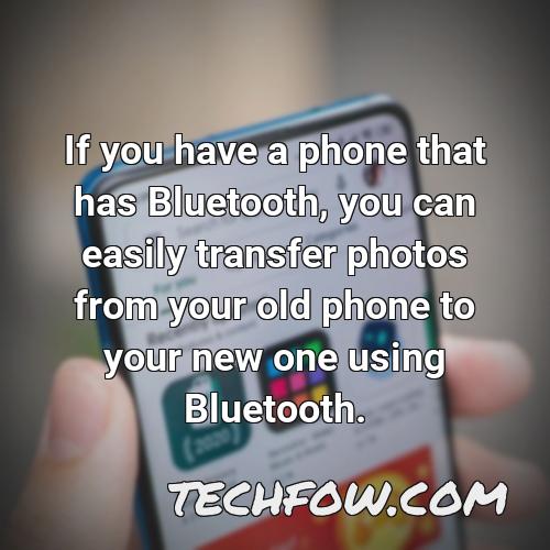 if you have a phone that has bluetooth you can easily transfer photos from your old phone to your new one using bluetooth