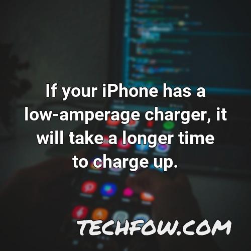 if your iphone has a low amperage charger it will take a longer time to charge up