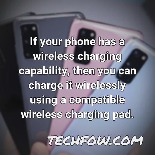 if your phone has a wireless charging capability then you can charge it wirelessly using a compatible wireless charging pad