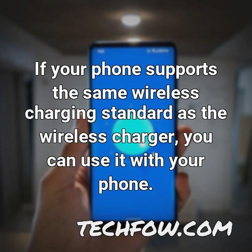 if your phone supports the same wireless charging standard as the wireless charger you can use it with your phone