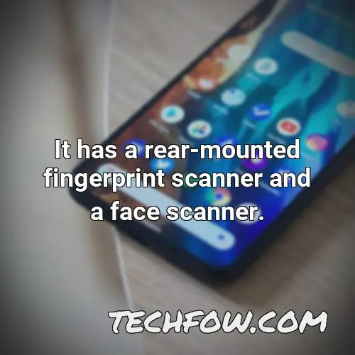 it has a rear mounted fingerprint scanner and a face scanner