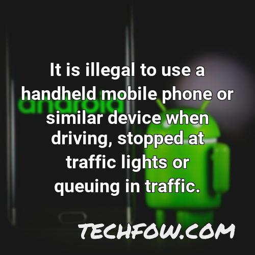 it is illegal to use a handheld mobile phone or similar device when driving stopped at traffic lights or queuing in traffic