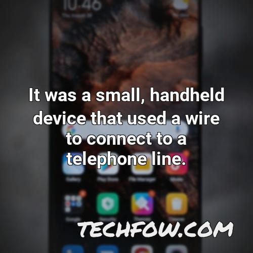it was a small handheld device that used a wire to connect to a telephone line