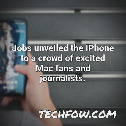 jobs unveiled the iphone to a crowd of excited mac fans and journalists