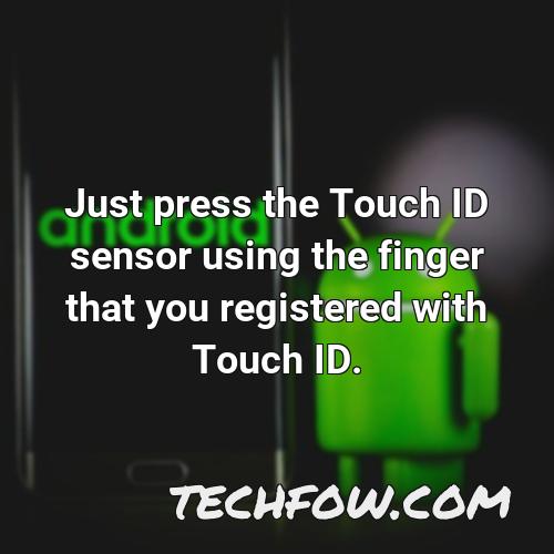 just press the touch id sensor using the finger that you registered with touch id 2