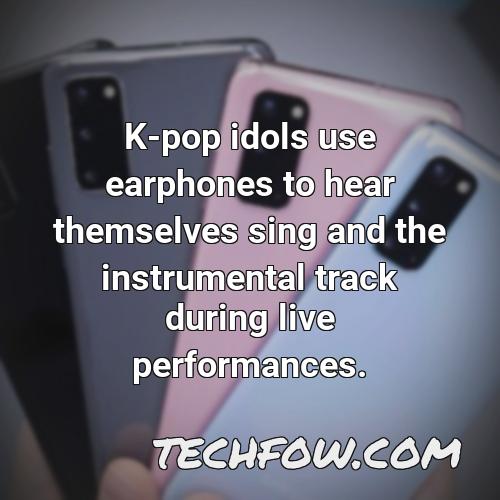k pop idols use earphones to hear themselves sing and the instrumental track during live performances